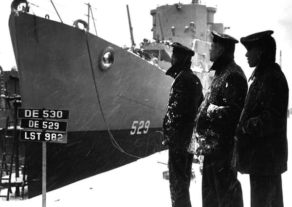 Sailors of the USS Mason (DE-529) commissioned at Boston Navy Yard on 20 March 1944  outside the ship, which was the first to have a  predominately black crew.