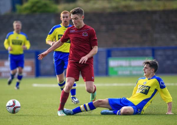 Midfielder Shane McGinty helped himself to a hat-trick at Bangor.