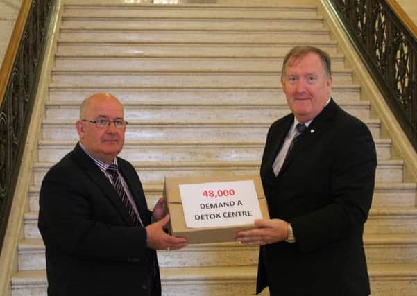 SDLP Foyle MLA Pat Ramsey presenting the 48,000 signature petition for a detox facility in Derry to Assembly Speaker William Hay back in May 2014.