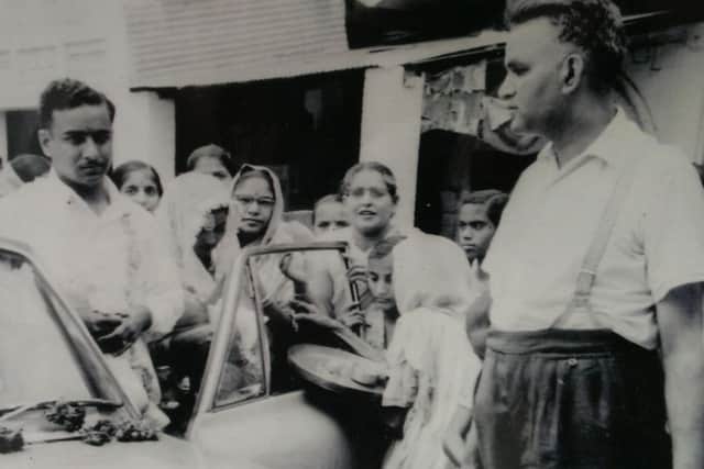 Charlotte's father (right) pictured beside a brand new Ford, which he had transported from England to India in the 1960s.