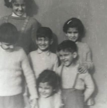 Charlotte (back, left) with her brothers and sisters.