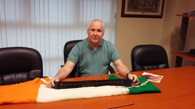 Gerry Cassidy with the Tricolour that was placed on Ned Breslin's and the belt that was presented to him in Mountjoy.
