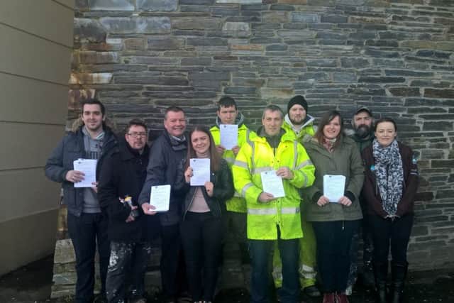 Members of the Triax Neighbourhood Management Team join Dog Warden Mickey Duddy as they leaflet Dove Gardens and Lecky Road about responsible dog ownership.