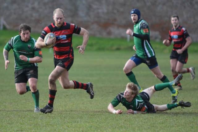 Armaghs captain, Neil Faloon, shakes off the City of Derry defence during the home side's 19-16 AIl 2B victory on Saturday.