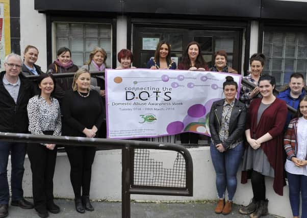 Pictured at the launch of Connecting the DOTS Domestic Awareness Week at Dove House on Thursday last are (back row, from left) Aileen McGuinness (BBHF), Sophie Blake-Gallagher (TRIAX), Colr Patricia Logue, Rosin Barton (Chairperson Dove House), Mayor of Derry and Strabane Colr Elisha McCallion, Paula Dalton (Advocacy Officer Dove House), Ann Doherty (Dove House), Clare Flanagan (Dove House), and Kyle Thompson (TRIAX). At the are Sean Collins CRJ (on the left), Donna Burke (Dove House), Bronagh McMonagle (Manager Dove House), Rachel Mullen (TRIAX), Emer McDaid (Dove House), and Taylor Burke (Dove House). The awareness week will run from 1st to the 8th March at various venues in the city.  DER 0816GS033
