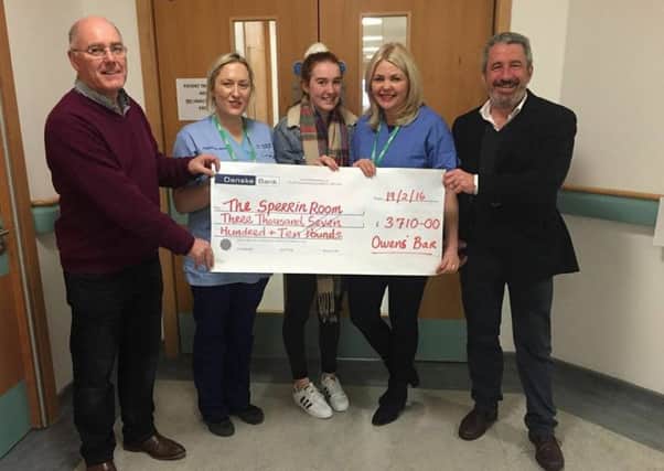 Gary Owens of Franks Owens bar in Limavady presents a cheque for the Sperrin Unit to Sperrin Unit Sister Tara McIntyre and Sperrin Unit nurse Jennifer McLaughlin. Also pictured are Orla Owens and David McFarland, Frank Owens bar.