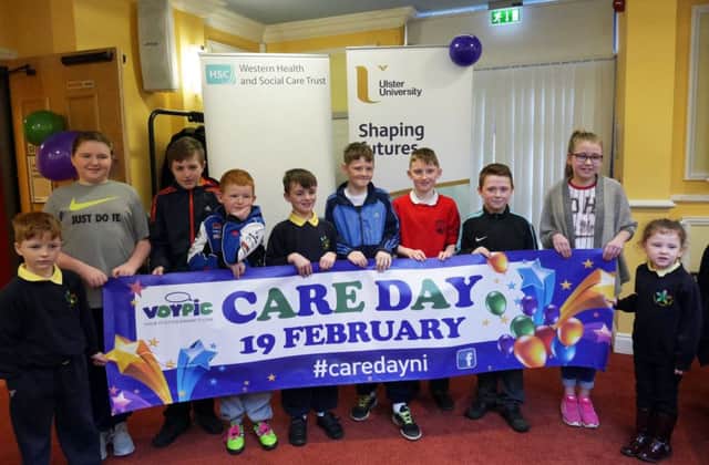 Children who took part in the programme stand promoting Care Day at the launch of the MY LACES programme.