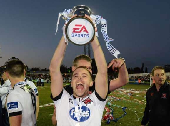 Derry City's new signing, Keith Ward, pictured lifting the EA Sports Cup with Dundalk, is looking forward to a make or break season with the 'Candy Stripes'.