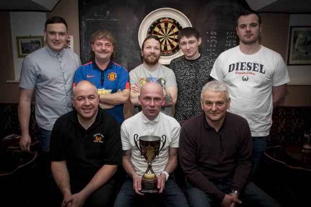 DARTS WINNERS. . . . .Phoenix, winners of the Cosh Bar & Grill Darts Cup last Friday night at the Coshquin venue. Front from left, Michael Wallace, Ryan Doherty (captain) and Eddie McDermott. Back from left, Stuart McKeever, Thomas Nixon, Noel Henry, Colin Kelly and Dan Gill. DER1716MC010