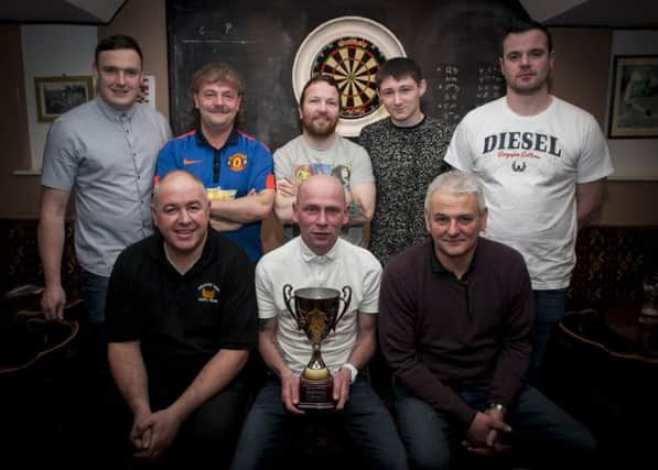 DARTS WINNERS. . . . .Phoenix, winners of the Cosh Bar & Grill Darts Cup last Friday night at the Coshquin venue. Front from left, Michael Wallace, Ryan Doherty (captain) and Eddie McDermott. Back from left, Stuart McKeever, Thomas Nixon, Noel Henry, Colin Kelly and Dan Gill. DER1716MC010