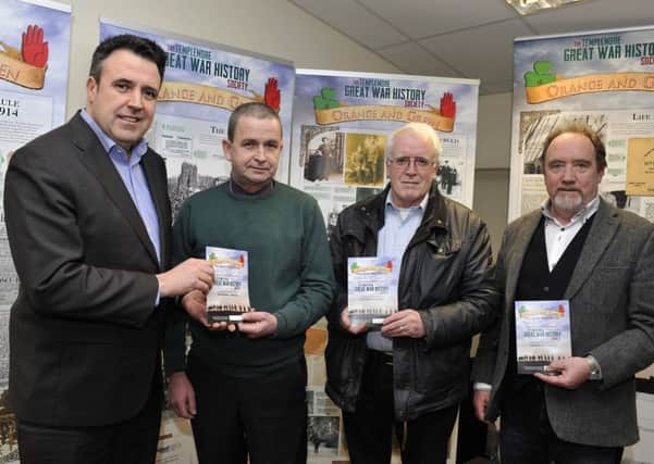Pictured at the launch of the 'Orange and Green: Derry and the First World War' exhibition at the Guildhall Press in Creggan's Rathmor Centre are Gerard Diver MLA (left), Seamus Breslin organiser from the Templemore Great War History Society, John Kelly Education and Outreach Officer Bloody Sunday Museum and Raymond Craig Guildhall Press.  DER0716GS065