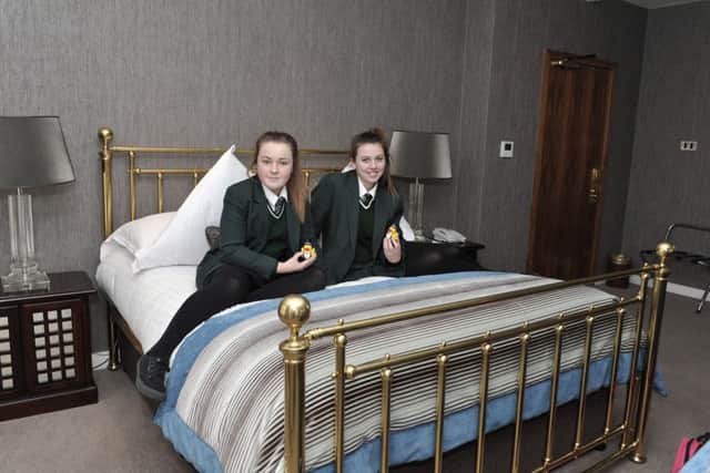 St Cecilias College students Caitlin Toland (on the left) and Shona McLaughlin relax in their suite during a work experience visit to the Everglades Hotel that included an overnight stay on Thursday last. DER0816GS039