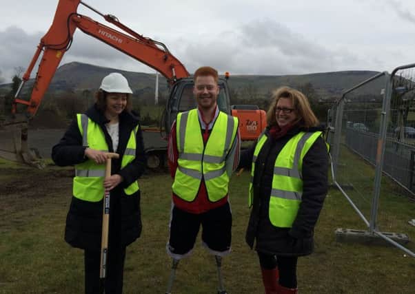 Sports minister Caral Ni Chuilin with Ryan O'connor and Donna O'Connor at the sod cutting on Curragh Road, Dungiven.