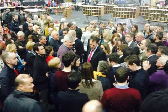 Supporters of Charlie McConalogue (centre) surround him as they wait for the results of the first count.
