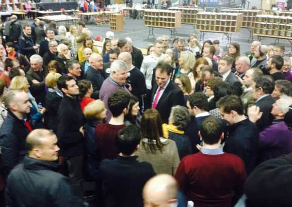 Supporters of Charlie McConalogue (centre) surround him as they wait for the results of the first count.