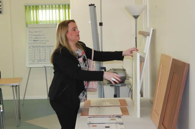 Sinn Fein Councillor Sandra Duffy examining some of the different fixtures and fittings residents can choose for their homes.
