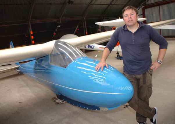 Owen Anderson pictured beside one of his refurbished gliders. (3108PG01)