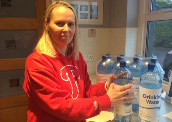 Marcie Kealey with supplies provided from NI Water.