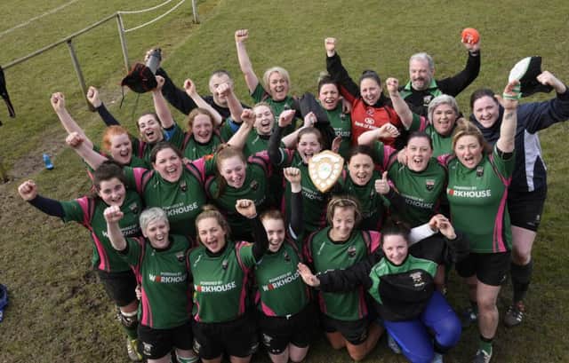 The City of Derry ladies squad celebrate their Rosie Stewart Shield win at Judges Road on Sunday. INLS1016-149KM