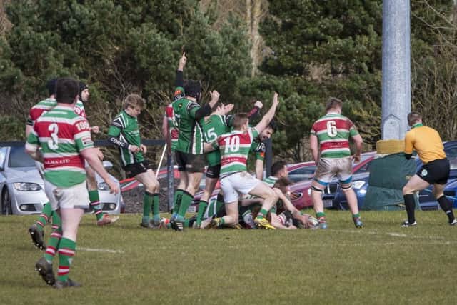 TRY OR NO TRY? . . . .Both sets of players appeal for the decision as City of Derry's David Graham gets over the lines against Sunday's Well game at Judges Road. DER0916MC024