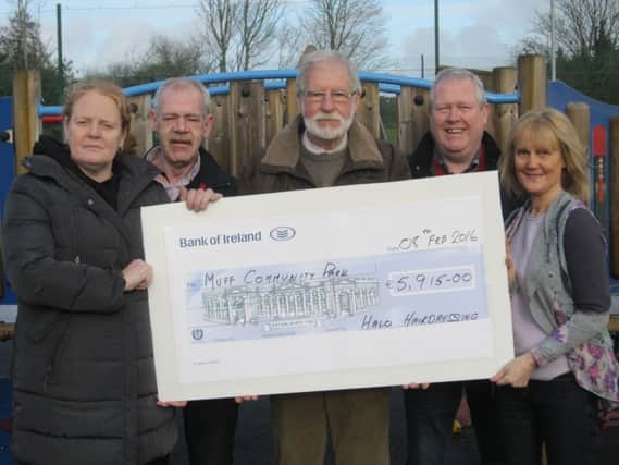 Committee members of Muff Community Development, R to L, Mandy Rudden, Willie Doherty, Bernard Breslin, Paul Mc Clintock and Bridget Mc Callion.
displaying a cheque for ¬5,915, the proceeds of Resale Therapy, a charity shop, operated by staff and volunteers of Halo Hairdressing. The committee wish to thank those who donated goods, volunteers who staffed the shop, customers who supported these ventures and Colm Mc Kenna who provided the premises. The shop raised a total of ¬7,322 for Muff Community Park.