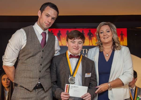 Adrian McMyler from Buncrana, who was one of only two highly commended finalists in the  junior category at the 2016 Pramerica Spirit of Community Awards gala awards ceremony, held at Lough Eske Castle Hotel & Spa, Donegal. He told the 'Journal' the event was the 'best night' of his life. Adrian is pictured with guest of honour Niall Breslin (Bressie) and Andrea McBride, Vice President, Pramerica Systems Ireland. See page 5 for more.
.