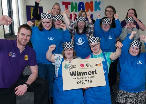 Chris Cooper and Lorraine Gallen, Foyle Down Syndrome Trust, Lucy Gollogly, Joanne McDowell, Big Lottery Fund and Carla Stojanovic, Foyle Down Syndrome Trust celebrate with members of the group , after they won Â£49,710 in the Big Lottery Fund's Peoples Projects competition.