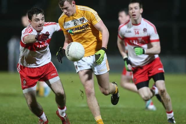 Antrim's Peter Healy and Derry's Niall Toner and Niall Laughlin

Mandatory Credit Photo Lorcan Doherty / Presseye.com