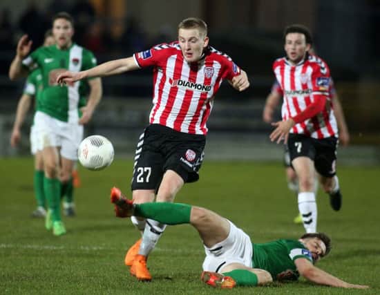 Derry City match winner, Ronan Curtis and Cork's Greg Bolger who was later sent off for a foul on the winger.

Mandatory Credit Photo Lorcan Doherty / Presseye.com