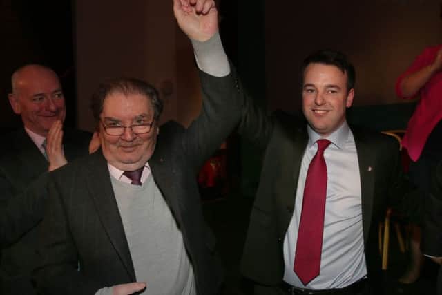 Former SDLP leader, John Hume pictured with current leader Colum Eastwood.
