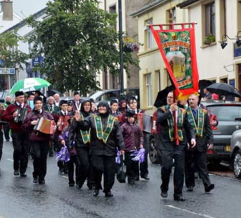 A wave to the crowd from members of St. Canice's AOH Dungiven.mm34-123ar. File pic