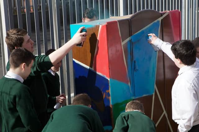 Pupils from Oakgrove College and St. Joseph's Boys' School testing their skills at spray painting a wardrobe at the launch of the of the 4rs Reuse Schools' Project, funded by the Housing Executives Community Cohesion Unit. (Photo - Tom Heaney, nwpresspics)
(Photo - Tom Heaney, nwpresspics)