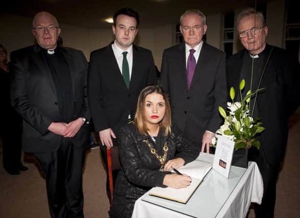 The Mayor of Derry City and Strabane District Council, Elisha McCallion pictured signing the Book of Condolence at St. Joseph's Church, Galliagh on Monday night, for the family who lost their lives in a tragic drowning accident in Buncrana on Sunday. Included from left are Fr. Michael McGaughey, PP, Galliagh, Colum Eastwood, SDLP leader, Martin McGuinness, Deputy First Minister and Dr. Donal McKeown, Bishop of Derry.