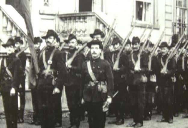 Capt Jack White pictured centre holding the ICA flag.