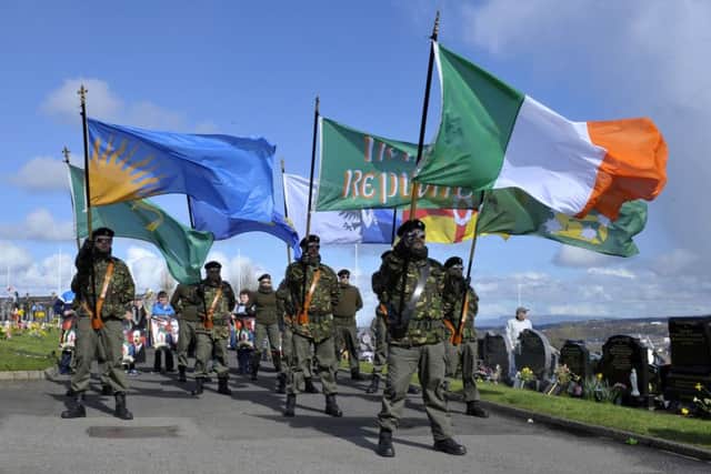 A colour party leads the 32 County Sovereignty Committee 1916 commemoration towards the Republican Plot in the City Cemetery on Easter Monday. DER1316GS023