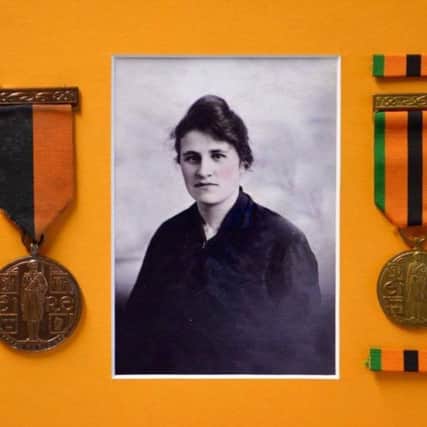 Elizabeth (Lizzie) Doherty from Waterloo Street in Derry was a member of Cumann na mBann. The medals on either side were awarded to her on the 50th anniversary.