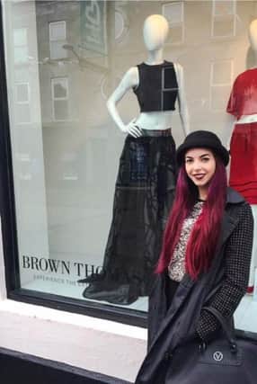 Limavady fashion designer, Kyree Forrest with her designs in the window of Brown Thomas in Galway.