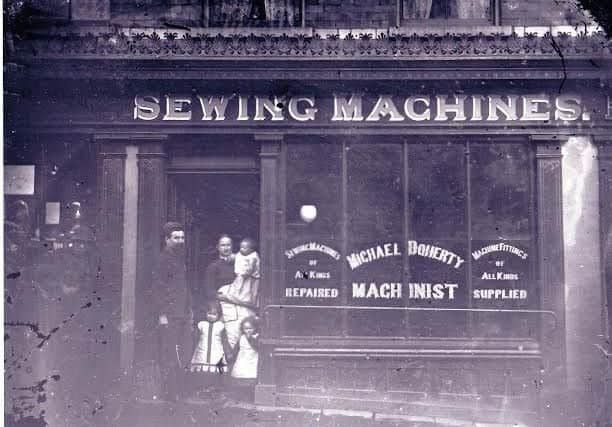 Elizabeth Doherty's parents outside their shop on Waterloo Street in the early 1900s.