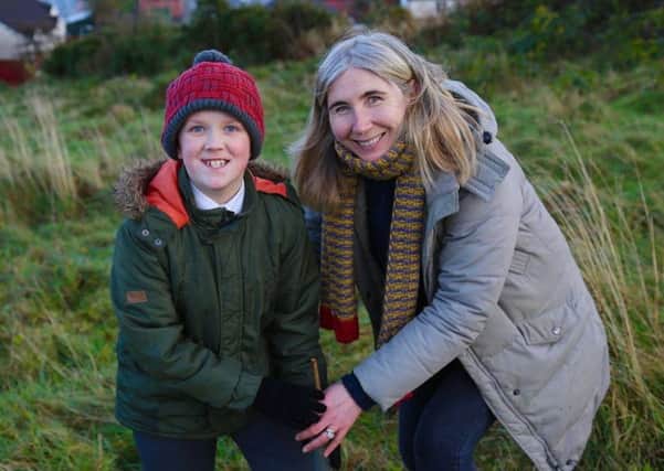 Tiernan Devine from Holy Family PS pictured with Shauna Kelpie, Acorn Fund Development Officer at the planting of 500 trees in Marianus Glen in Derry, an initiative of the Acorn Fund to help improve local communities. Tiernan also helped launch the Acorn Fund's City of Culture Legacy Grants programme, which is now open for applications.