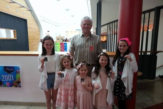 Feis Secretary, Pat McCafferty, pictured with the Doherty sisters and their medals. From left are Rianne 2nd (11-12 yrs Eng Song), Lauren 2nd (P6 Eng  Song, 2nd Sacred Solo  and  finalist in 8-12 yrs Musical Theatre), Abbie 2nd (P4 Eng Song), Sarah 2nd (P3 Eng Song) and  Alannah 3rd (Under 5 yrs Eng Song) from the R. McGlinchey School of Music and pupils of St AnnesPrimary School and St. Cecilias College.