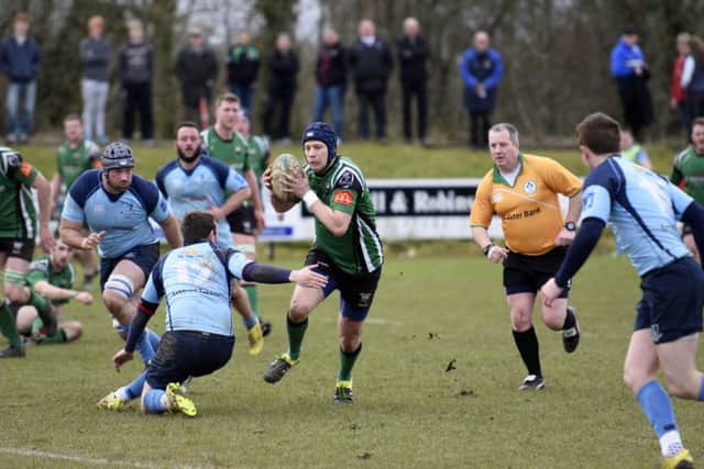City of Derry's Richard McCarter probes for a gap in the Barnhall lines during Saturday's final AIL Division 2b game of the season. DER1416-104KM