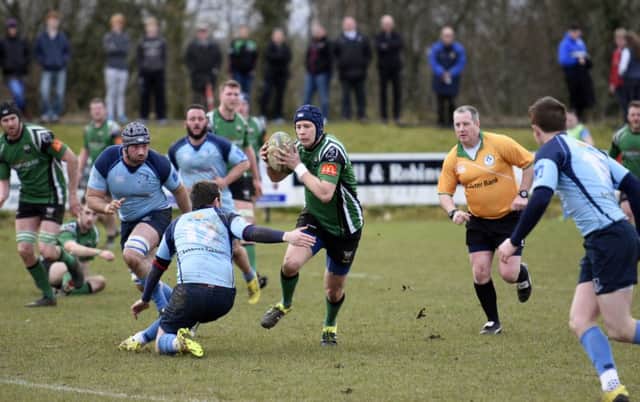 City of Derry's Richard McCarter probes for a gap in the Barnhall lines during Saturday's final AIL Division 2b game of the season. DER1416-104KM