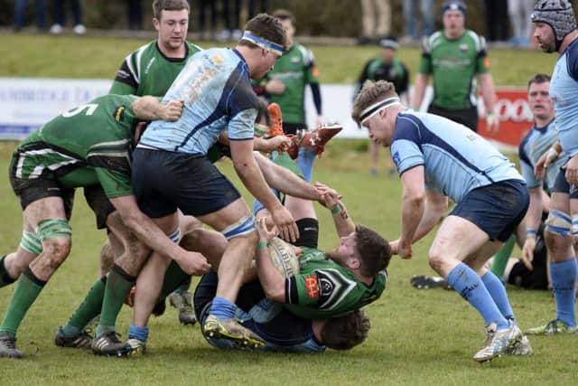 City of Derry hooker Cathal Cregan is hauled down just short of the Barnhall try-line. DER1416-106KM