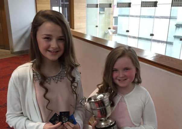 Sisters, Laura & Beth Bradley who were prize winners at this year's Derry Feis. Laura came first in "The Irish Song", aged 12-14; second in "The English Song",aged 12-14 and third in "Junior Any Song", aged 12- 16. Beth won "The Lawrence Hasson Cup" for English Song, aged 10-12; second in "The Junior Any Song", aged 10-12; second in "The Original Poem" and third in The Studied Prose. They are pupils if "Margaret Keys School of Music" and "Class Act School of Speech & Drama"