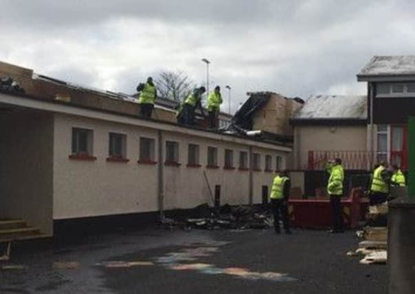 The picture posted by Sinn Fein MLA Maeve McLaughlin showing the clean up at Holy Child Primary School at Central Drive in Creggan.