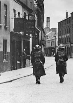 Members of the British Armys Dorset Regiment on patrol in Foyle Street in Derry in 1920.