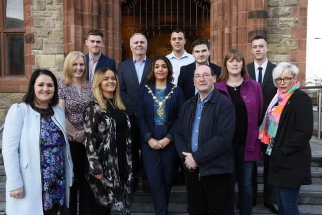 The Mayor, Councillor Elisha McCallion pictured with staff and board members at the 20th anniversary celebrations of the Off The Street Community Youth Initiative in the Guildhall on Wednesday night. DER1316-107KM