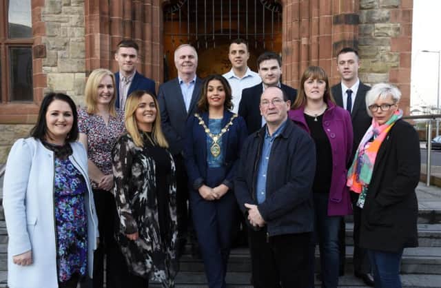 The Mayor, Councillor Elisha McCallion pictured with staff and board members at the 20th anniversary celebrations of the Off The Street Community Youth Initiative in the Guildhall on Wednesday night. DER1316-107KM