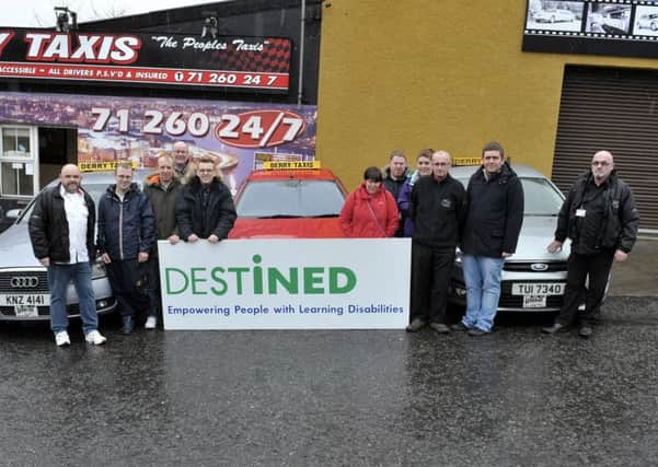 Members from the DESTINED voluntary charitable organisation pictured with drivers from Derry Taxis Glenbrook Terrace at the launch of their partnership on Friday afternoon last. DER1416GS043