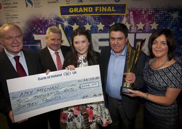 Talent Northwest 2016 winner, 13 years-old Amy Meehan pictured receiving her winner's cheque from Deputy First Minister Martin McGuinness this week. The young singer/musician won this year's title coming out on top at the final in the Millennium Forum on Easter Saturday. Included are Oliver Green, Talent Northwest producer and proud parents, John and Alice. Young Amy made a sizeable donation of her winnings to the Buncrana Tragedy Appeal.